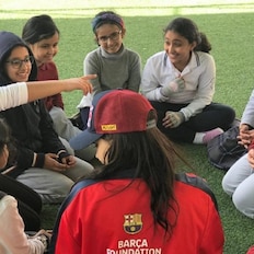 Children playing football at a futbolnet event in Saudi Arabia