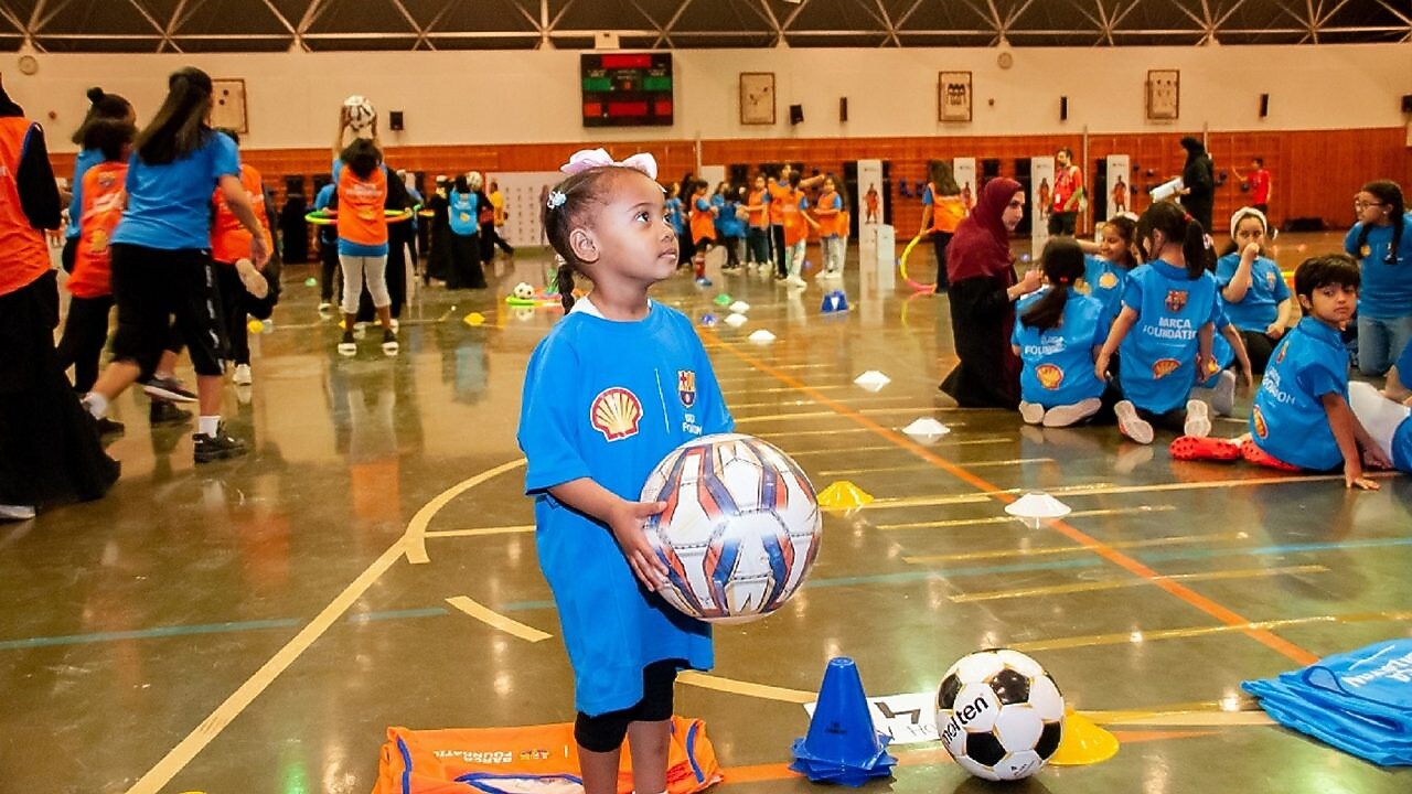 Children playing football at a futbolnet event in Saudi Arabia