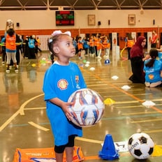 Children playing football at a futbolnet event in Saudi Arabia