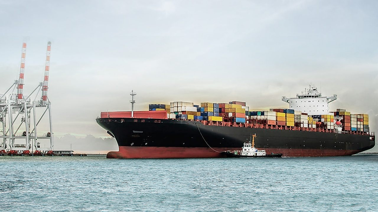 large tanker at sea loaded with container crates