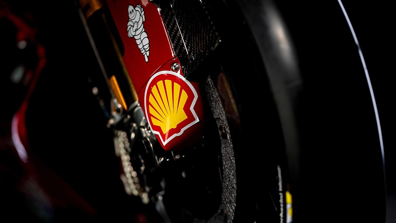 Motorcycle fork with Shell and Michelin stickers