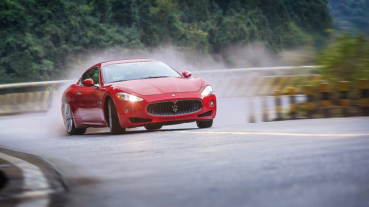 A red Maserati speeds uphill in the Shell Helix Ultra film We Know Why You Drive