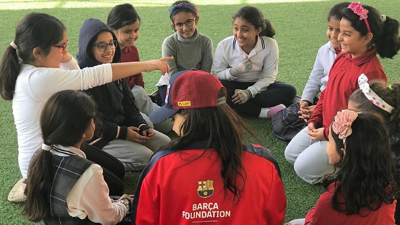 Children playing football at a futbolnet event in Saudi Arabia