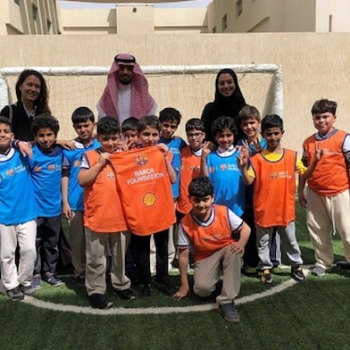 Children playing football at a futbolnet event in Saudi Arabia