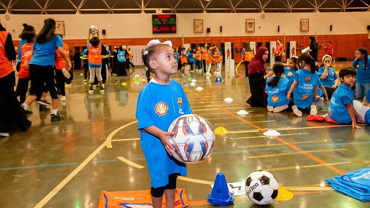 Children playing football at a futbolnet event in Saudi Arabia