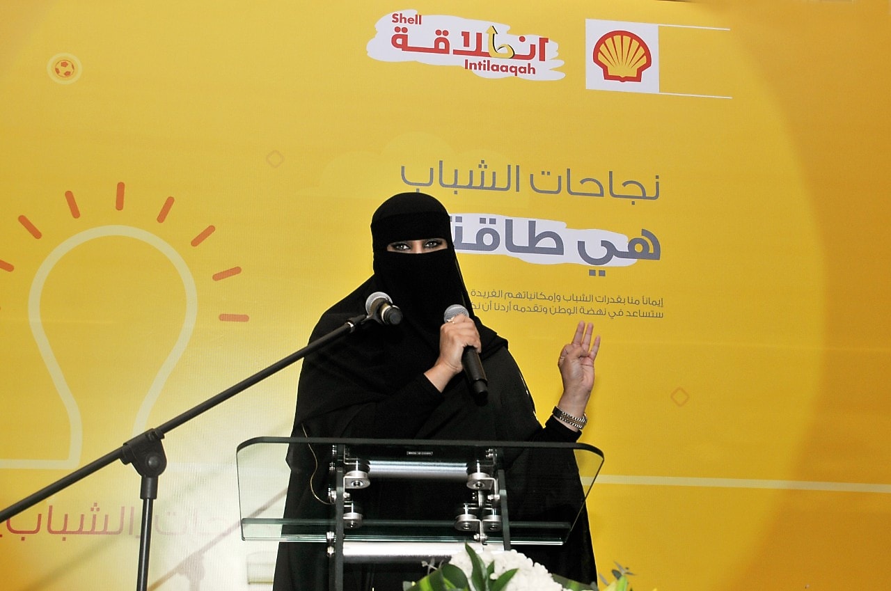 Saudi female speaker in Abaya